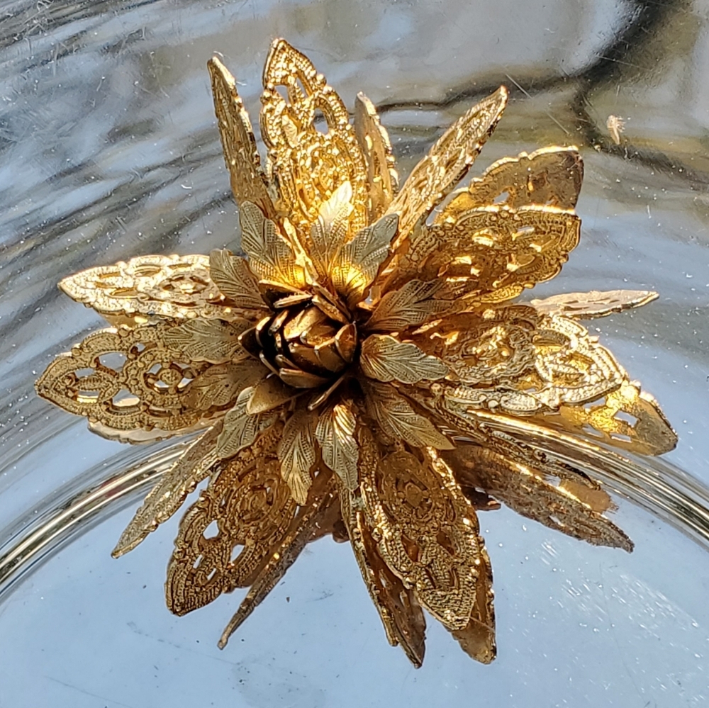 Vintage gold tone flower burst pin